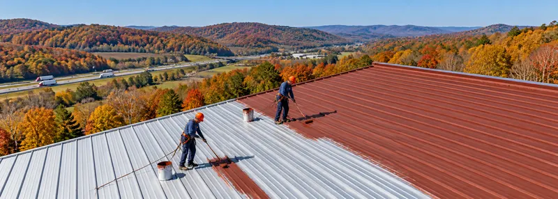 Crew working across a long metal roof