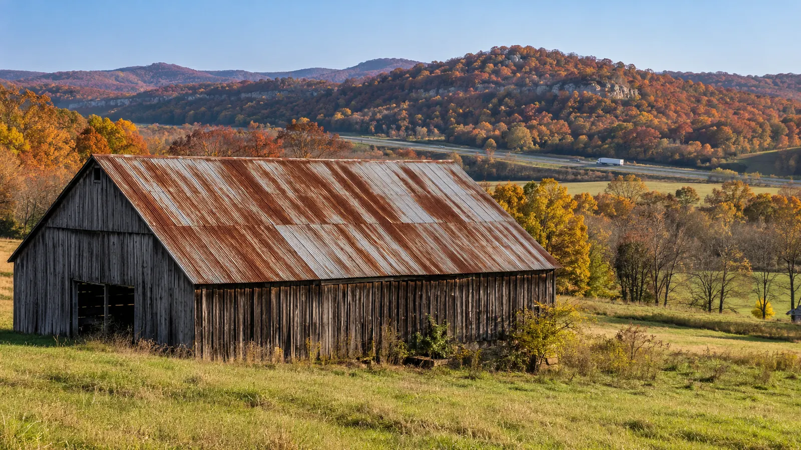 Older barn with a rusted metal roof in rural Hardin County near Glendale