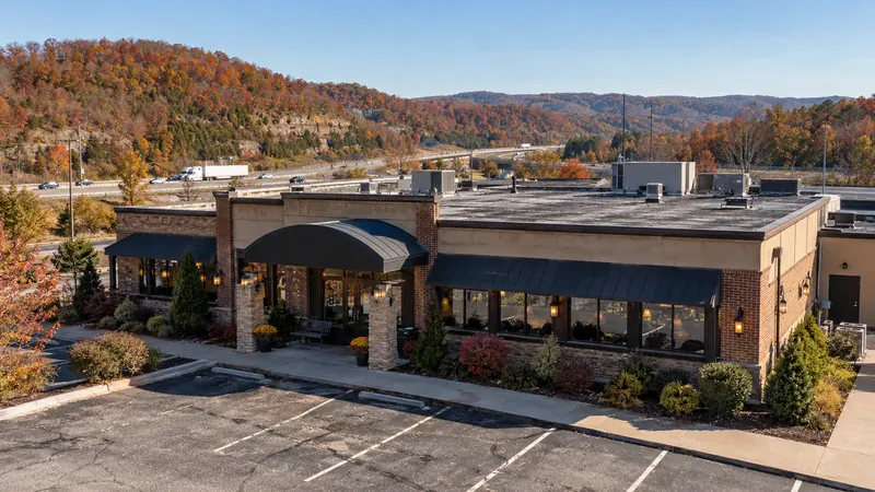 Low commercial building with a flat roof section