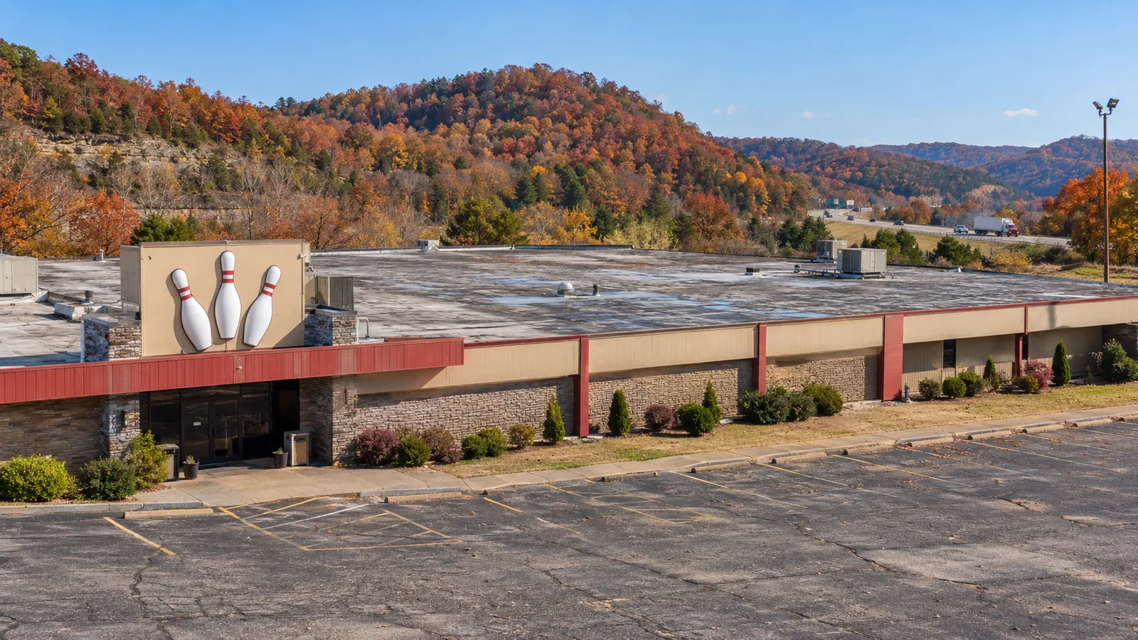 Brick commercial building with a low roof behind a parapet in Hodgenville, KY